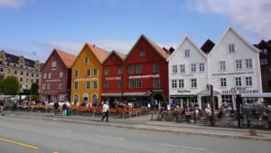 Bryggen in Bergen is a historic harbor district with colorful wooden houses that is a UNESCO World Heritage Site and is known for its Hanseatic history.